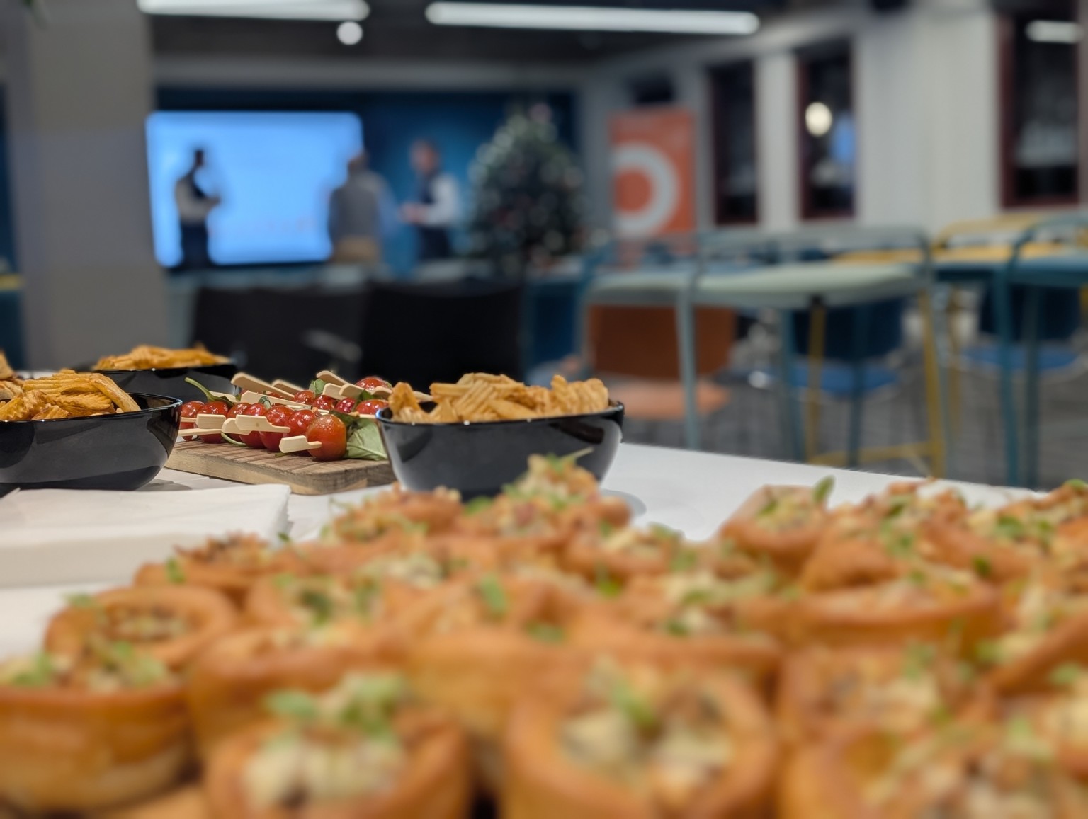 Savoury bites and skewers laid out at a business event